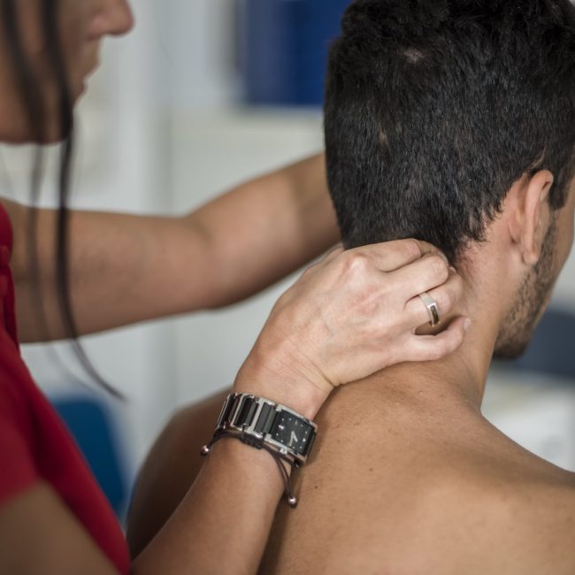 man-receiving-neck-massage-from-healthcare-profess-2026-01-05-00-53-31-utc